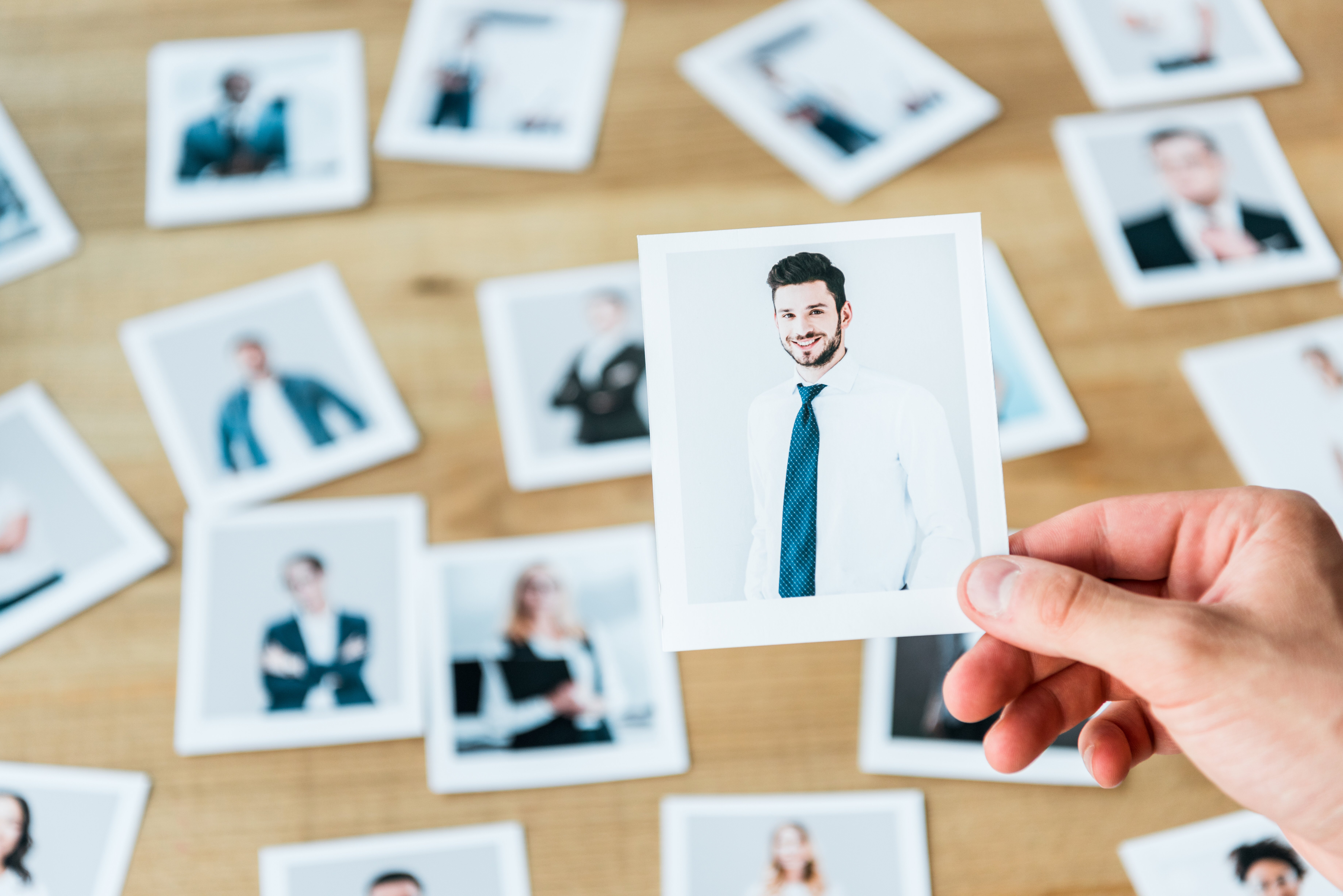 The recruiter is looking at candidate profiles for talent acquisition